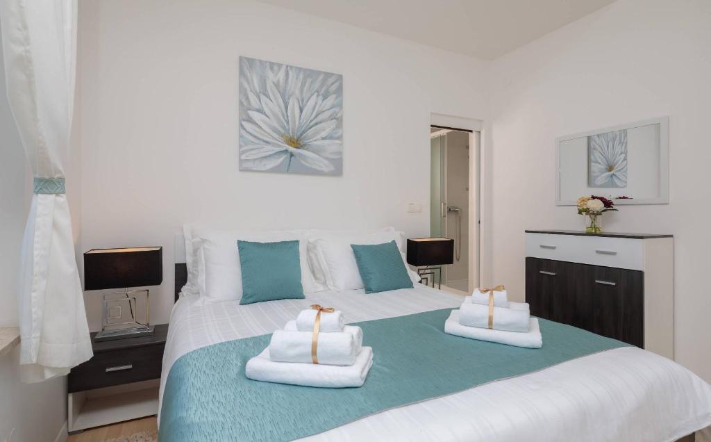 Posteľ alebo postele v izbe v ubytovaní Apartments CenterLink