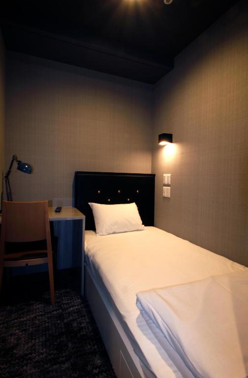 Postel nebo postele na pokoji v ubytování Hotel M Matsumoto