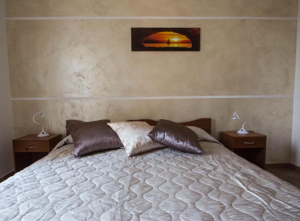Postel nebo postele na pokoji v ubytování B&B "Posta di Colonna"