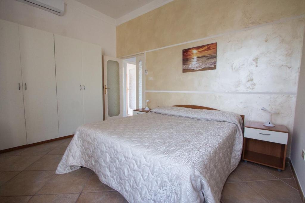 Postel nebo postele na pokoji v ubytování B&B "Posta di Colonna"