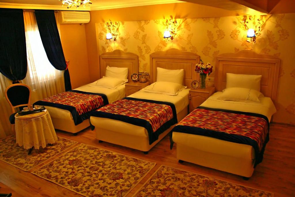 Postel nebo postele na pokoji v ubytování Divas Hotel