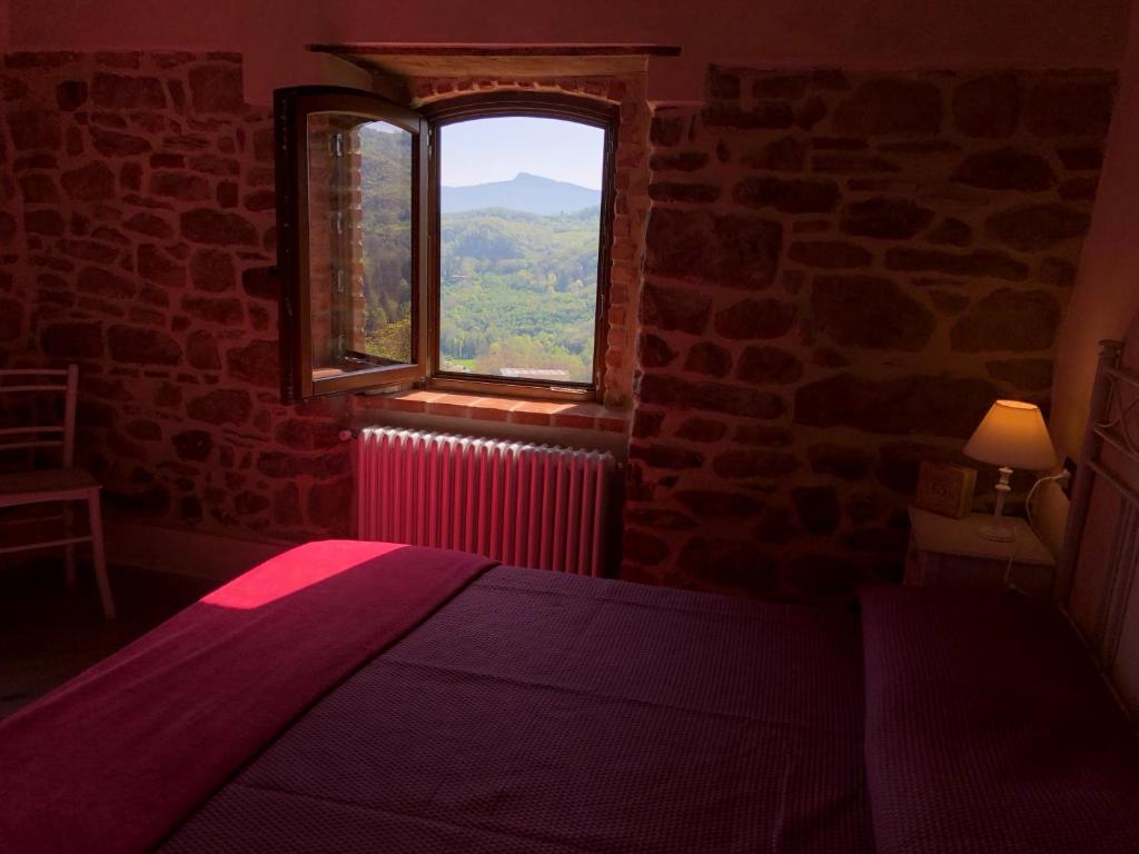 Postel nebo postele na pokoji v ubytování Iris Country House