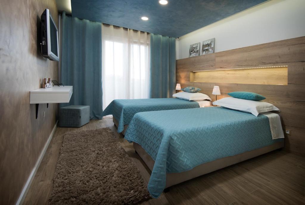 Postel nebo postele na pokoji v ubytování Guest House Laura