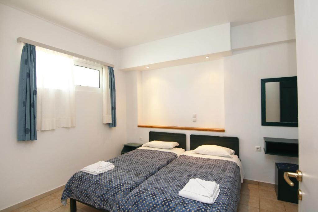 Postel nebo postele na pokoji v ubytování Evropi Hotel