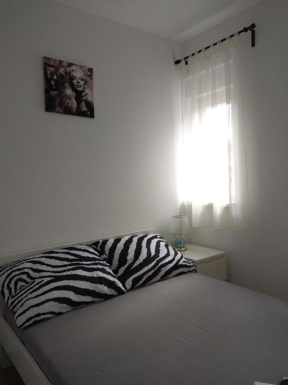 Postel nebo postele na pokoji v ubytování Apartment Domagoj, Novalja