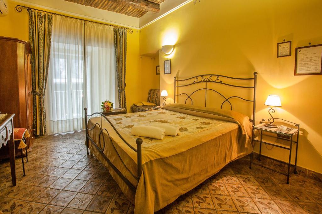 Posteľ alebo postele v izbe v ubytovaní B&B L'Alloggio Dei Vassalli