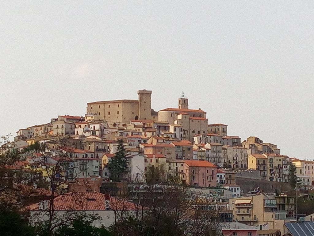 a town on top of a hill with houses at Casa Borrelli in Casoli