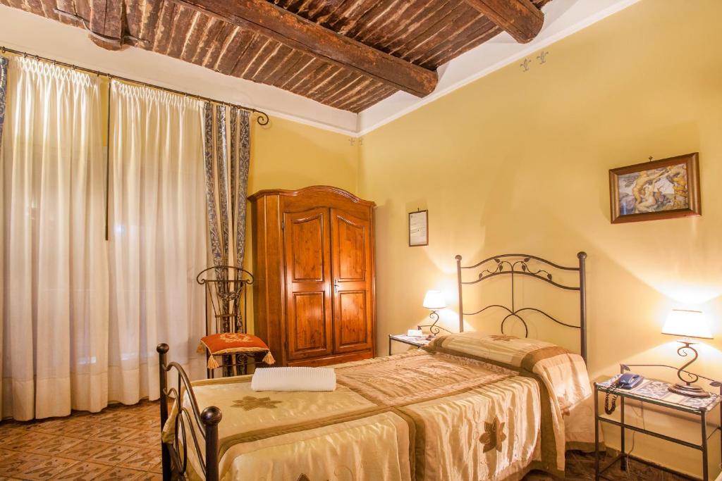 Posteľ alebo postele v izbe v ubytovaní B&B L'Alloggio Dei Vassalli