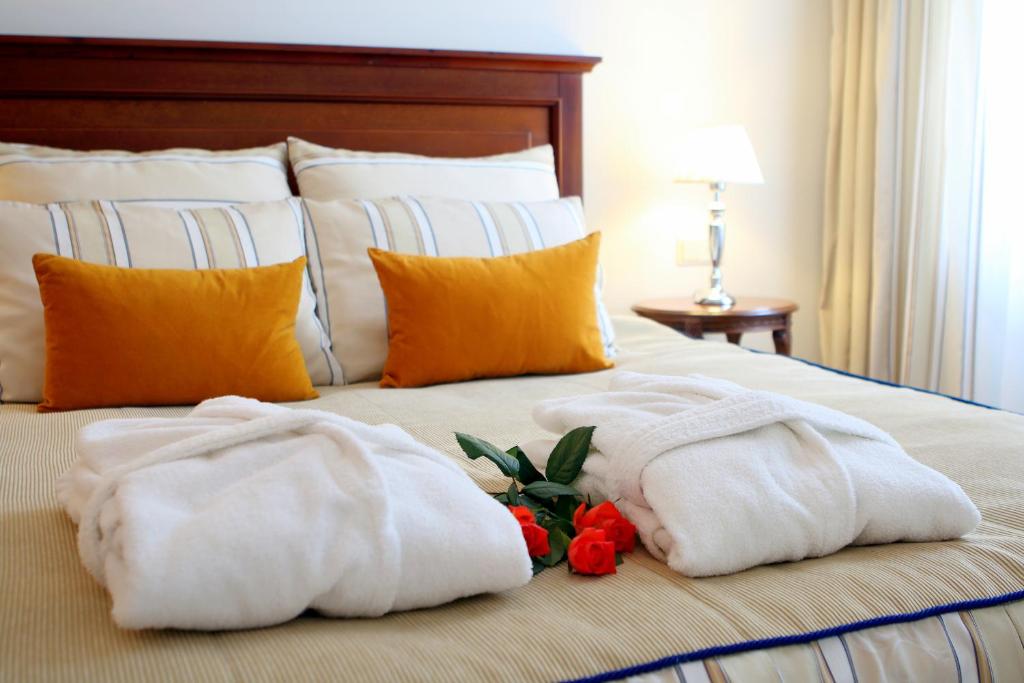 Postel nebo postele na pokoji v ubytování Hestia Hotel Draugi