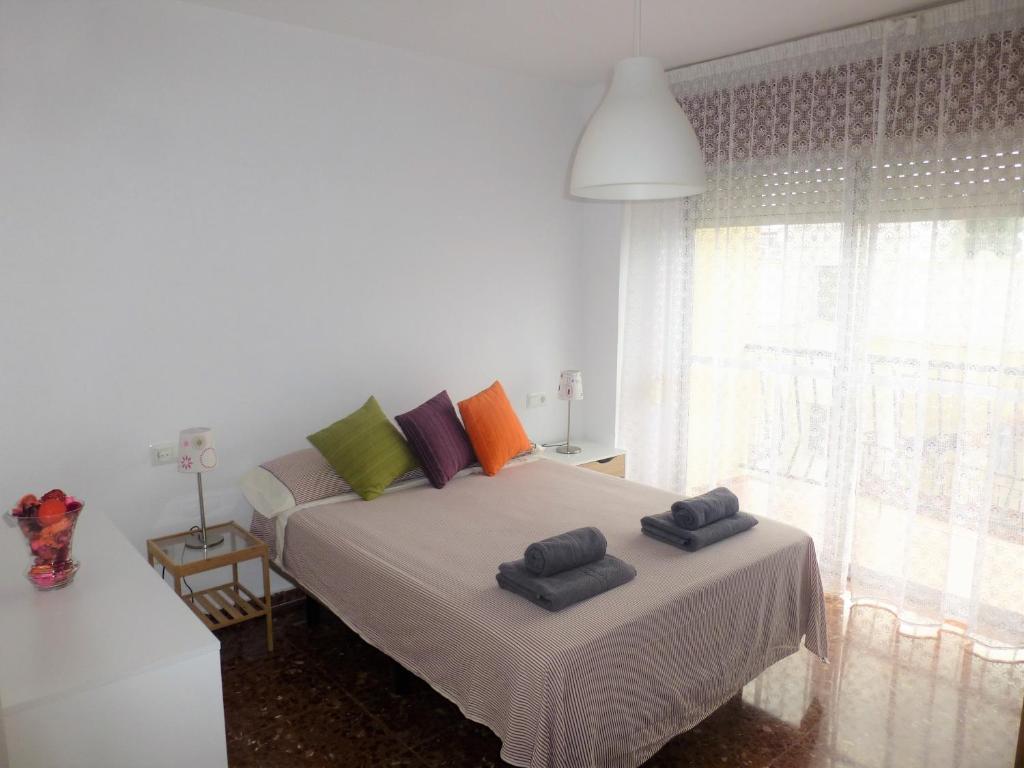 Łóżko lub łóżka w pokoju w obiekcie apartamento centrico y luminoso