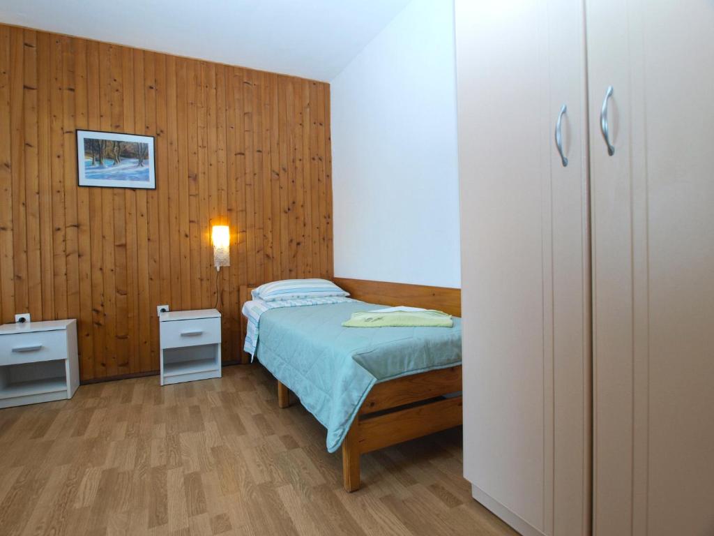 Postel nebo postele na pokoji v ubytování Apartments Dragana 1508