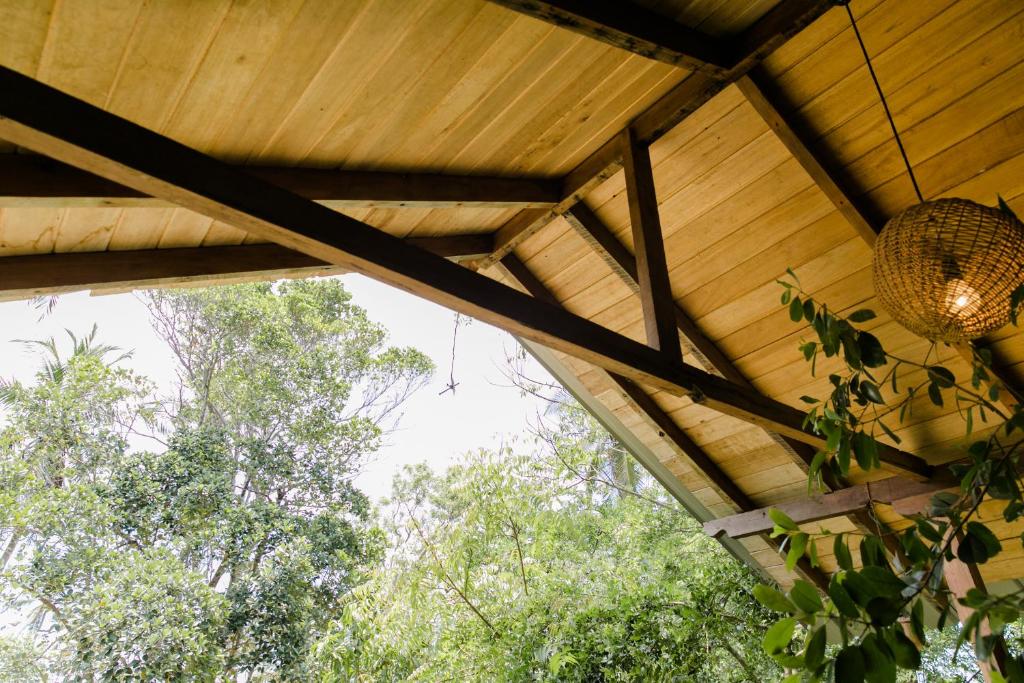 a ceiling of a house with trees in the background at Nuga Eden Tangalle in Tangalle