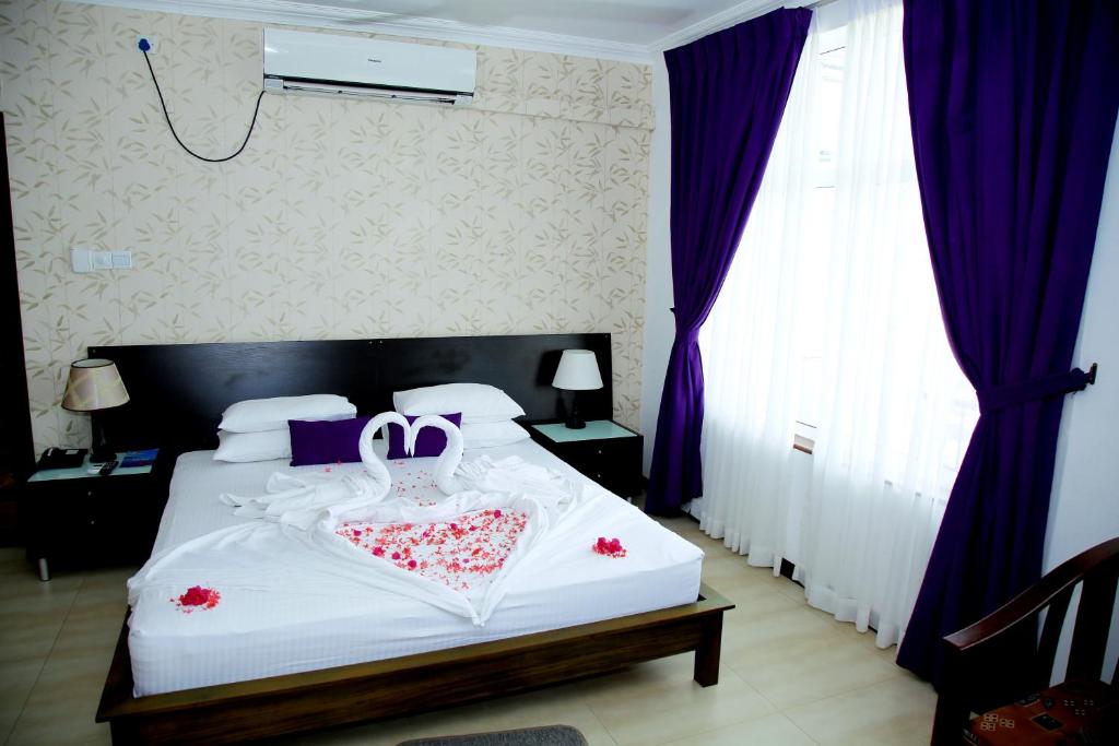 Postel nebo postele na pokoji v ubytování Hotel East Lagoon