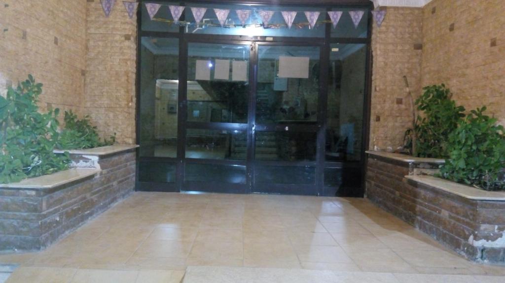 an entrance to a building with a glass door at Hamdy 5 Star (Families Only) in Cairo