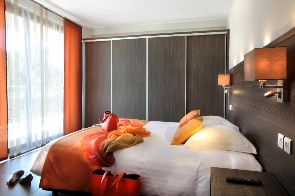 Postel nebo postele na pokoji v ubytování Seventeen Hotel