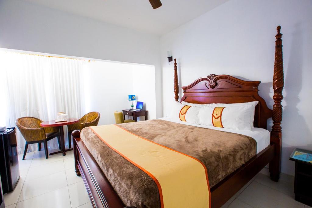 Postel nebo postele na pokoji v ubytování Altamont Court Hotel