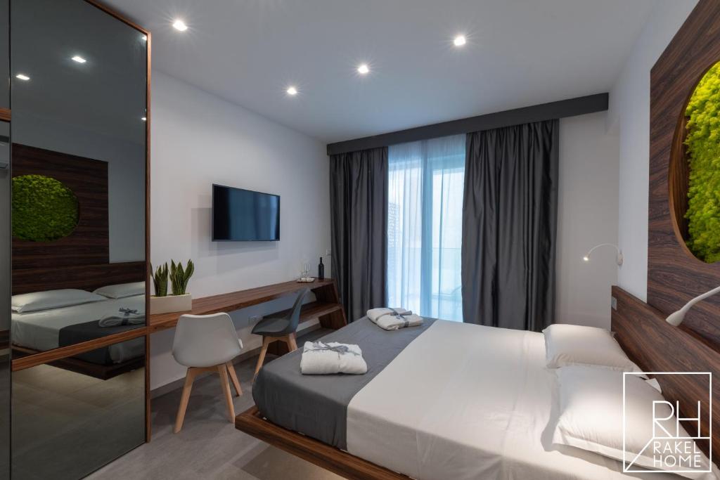 A bed or beds in a room at B&B Rakel Home