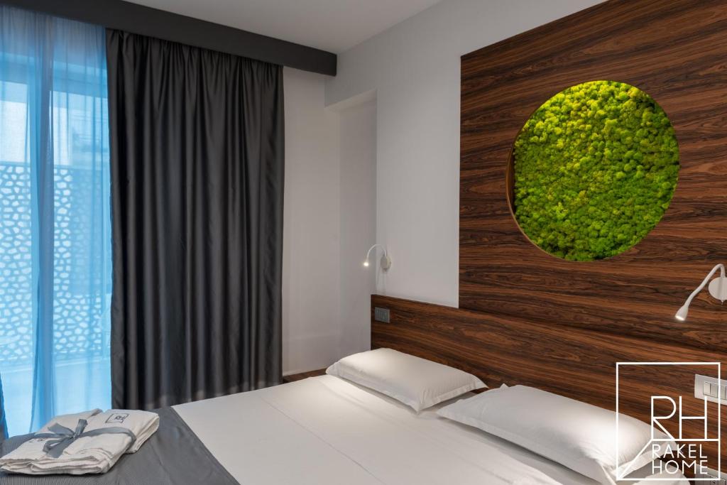A bed or beds in a room at B&B Rakel Home