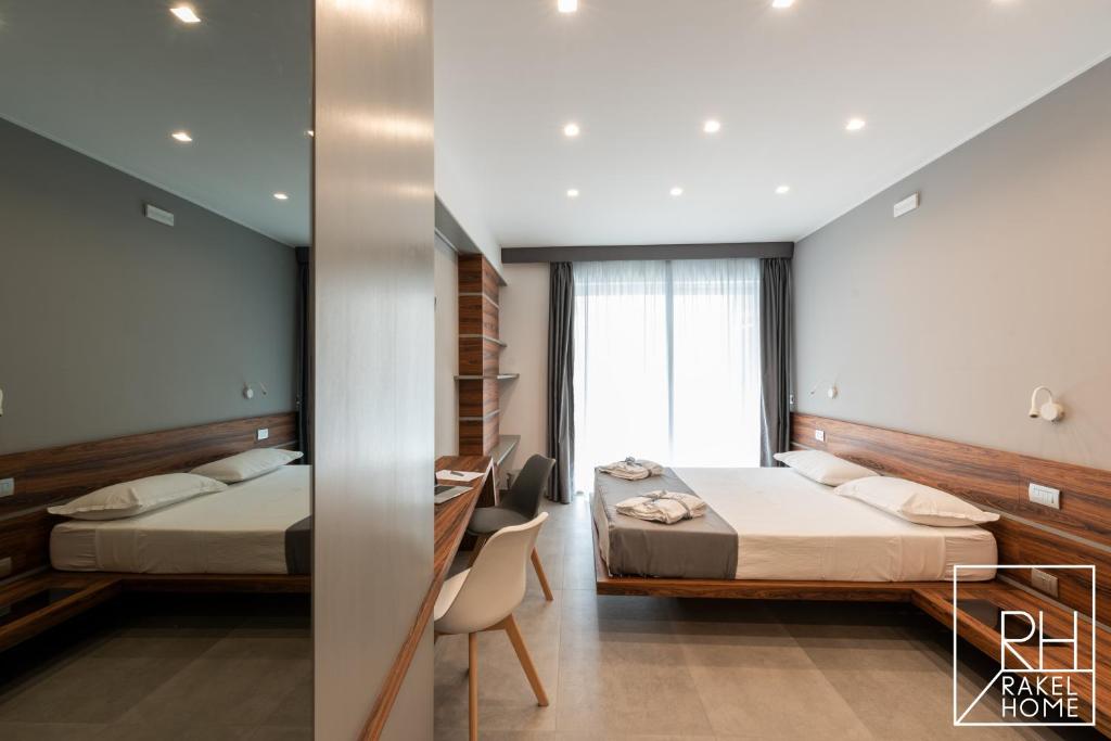 A bed or beds in a room at B&B Rakel Home