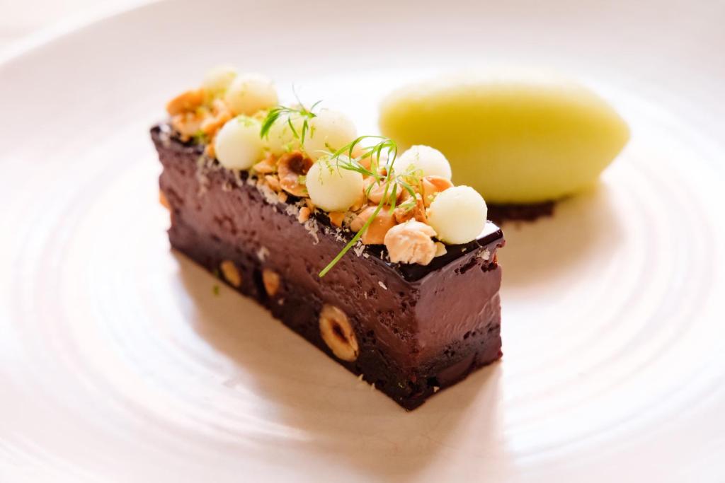 a piece of chocolate cake on a white plate at Wykeham Arms in Winchester