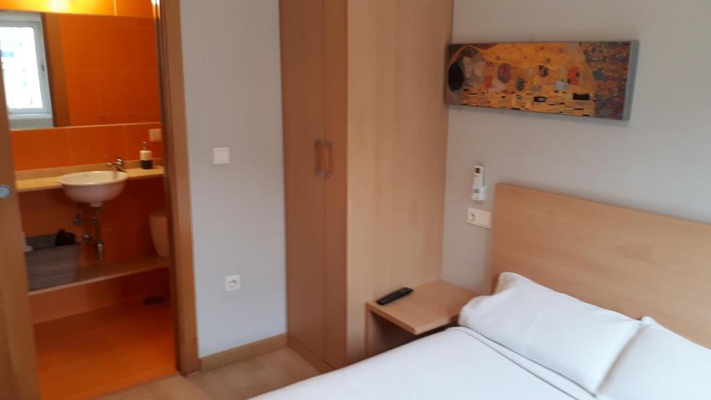 Een bed of bedden in een kamer bij PR Blanco