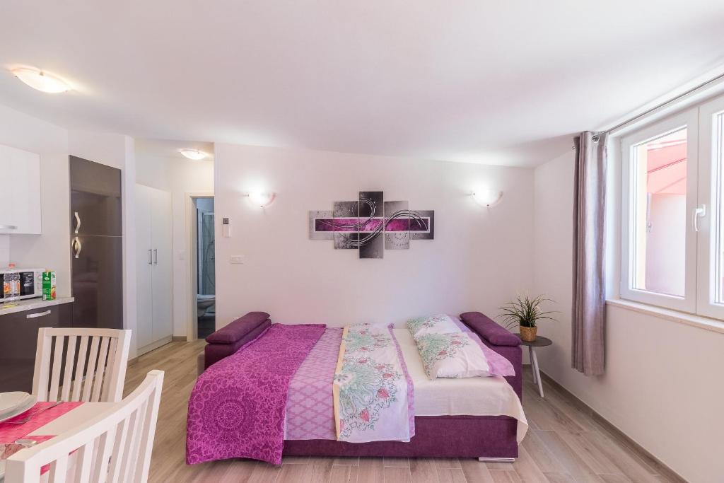 Postel nebo postele na pokoji v ubytování Apartment Taja