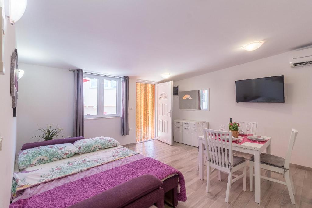 Postel nebo postele na pokoji v ubytování Apartment Taja