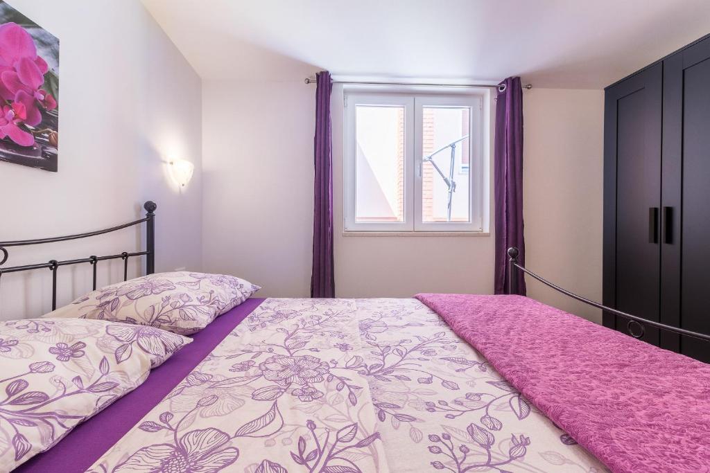 Postel nebo postele na pokoji v ubytování Apartment Taja
