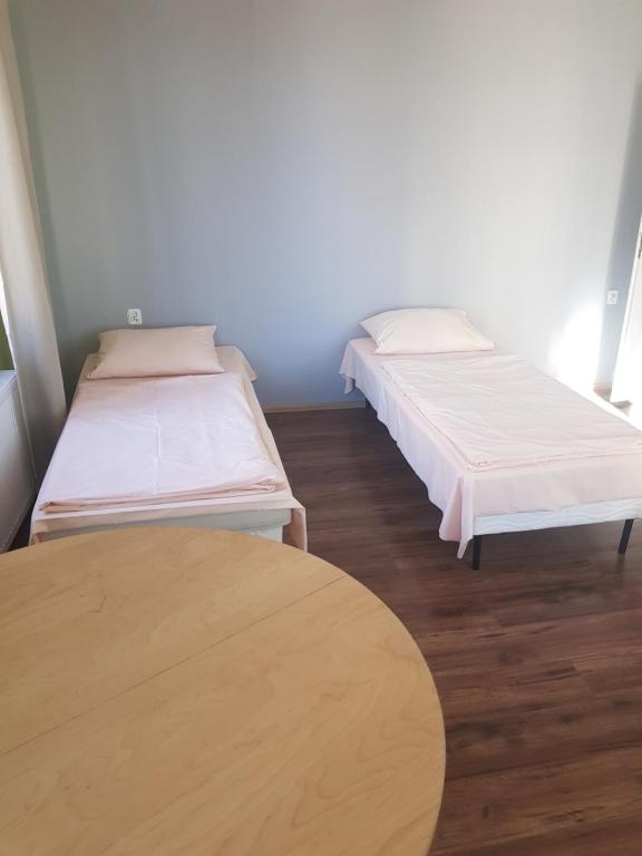 Postel nebo postele na pokoji v ubytování Kaktus Guest House