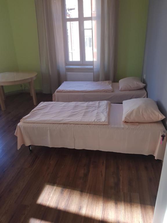 Postel nebo postele na pokoji v ubytování Kaktus Guest House