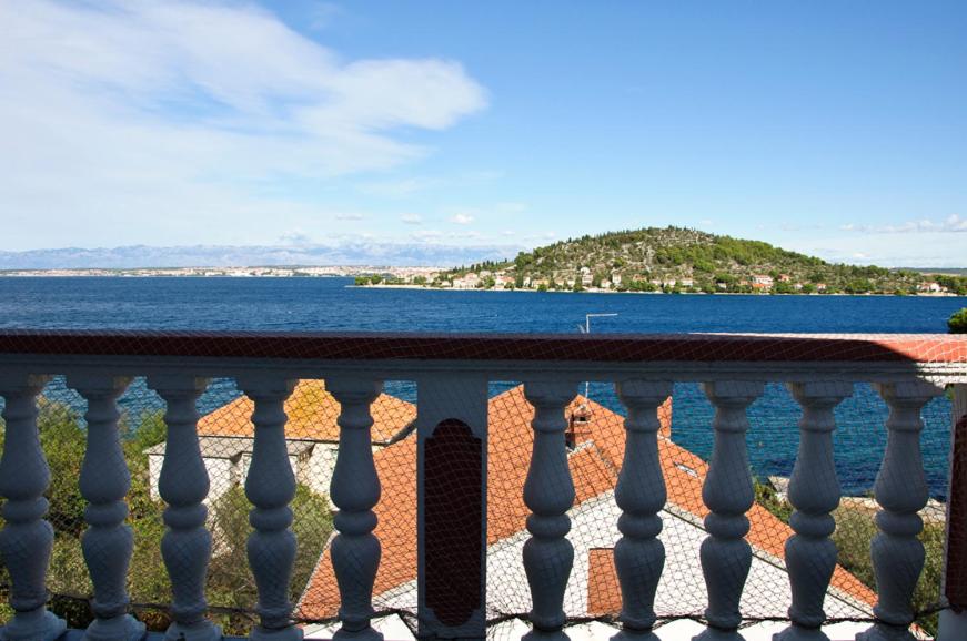 a view of the ocean from a balcony at Apartmani Blaslov in Kali