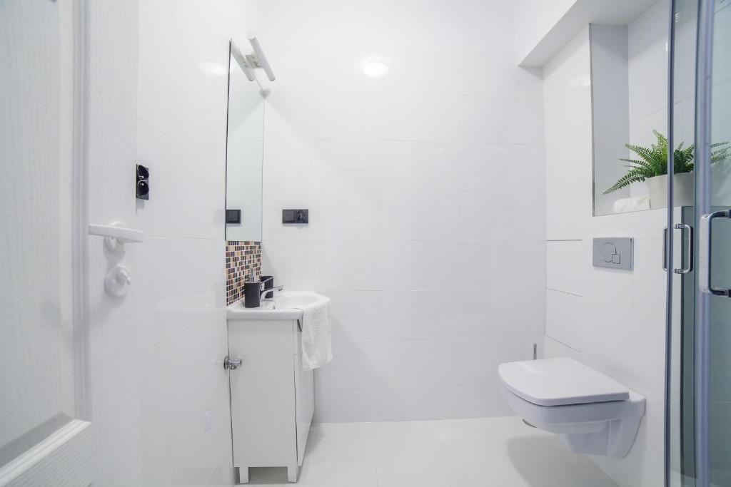 Kúpeľňa v ubytovaní Apartments Madelaine Warsaw by Noclegi Renters