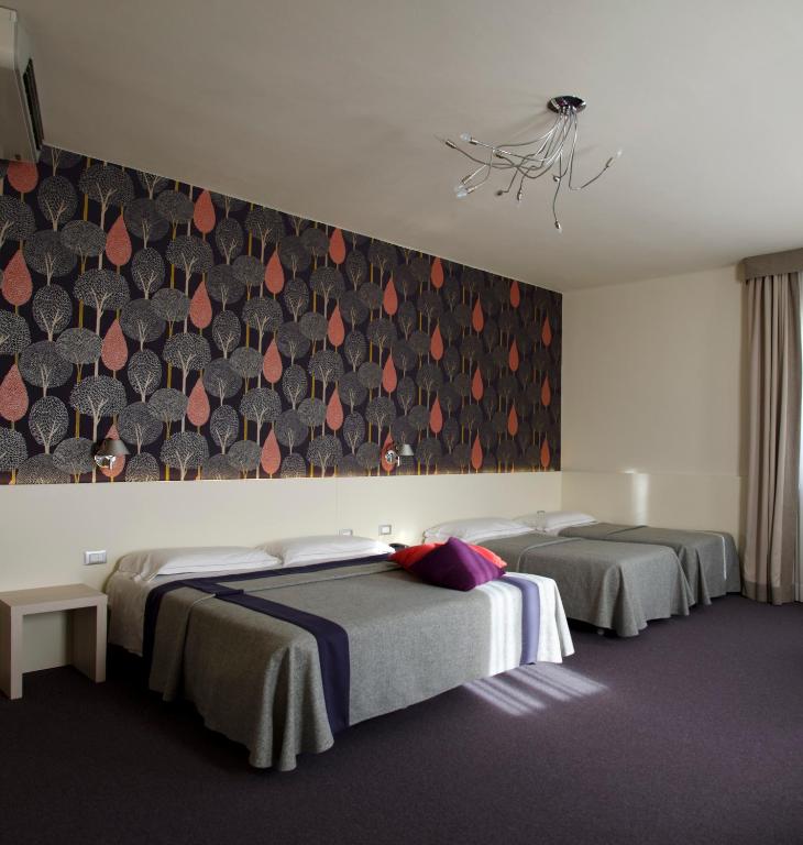 Postel nebo postele na pokoji v ubytování Key Hotel