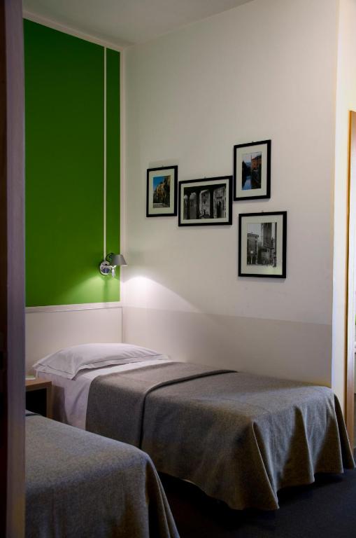 Postel nebo postele na pokoji v ubytování Key Hotel