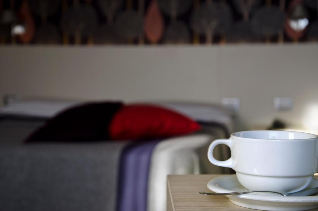 Postel nebo postele na pokoji v ubytování Key Hotel