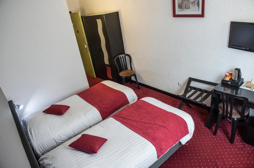 Postel nebo postele na pokoji v ubytování Logis Murtel