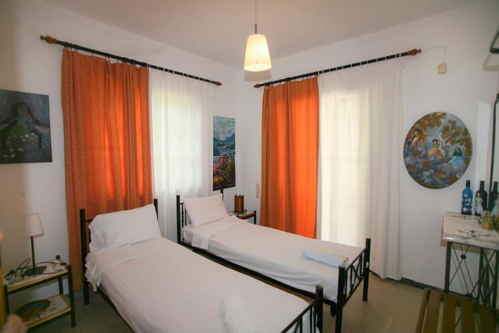 Postel nebo postele na pokoji v ubytování Nakou House