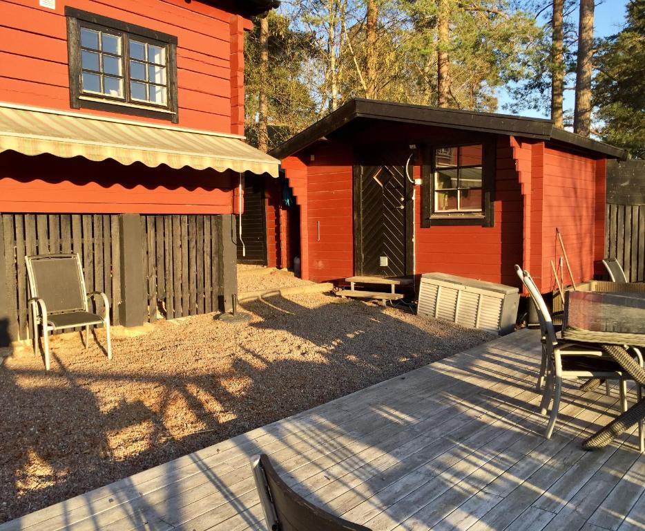 a patio of a house with a table and chairs at Näkna Hill in Åby