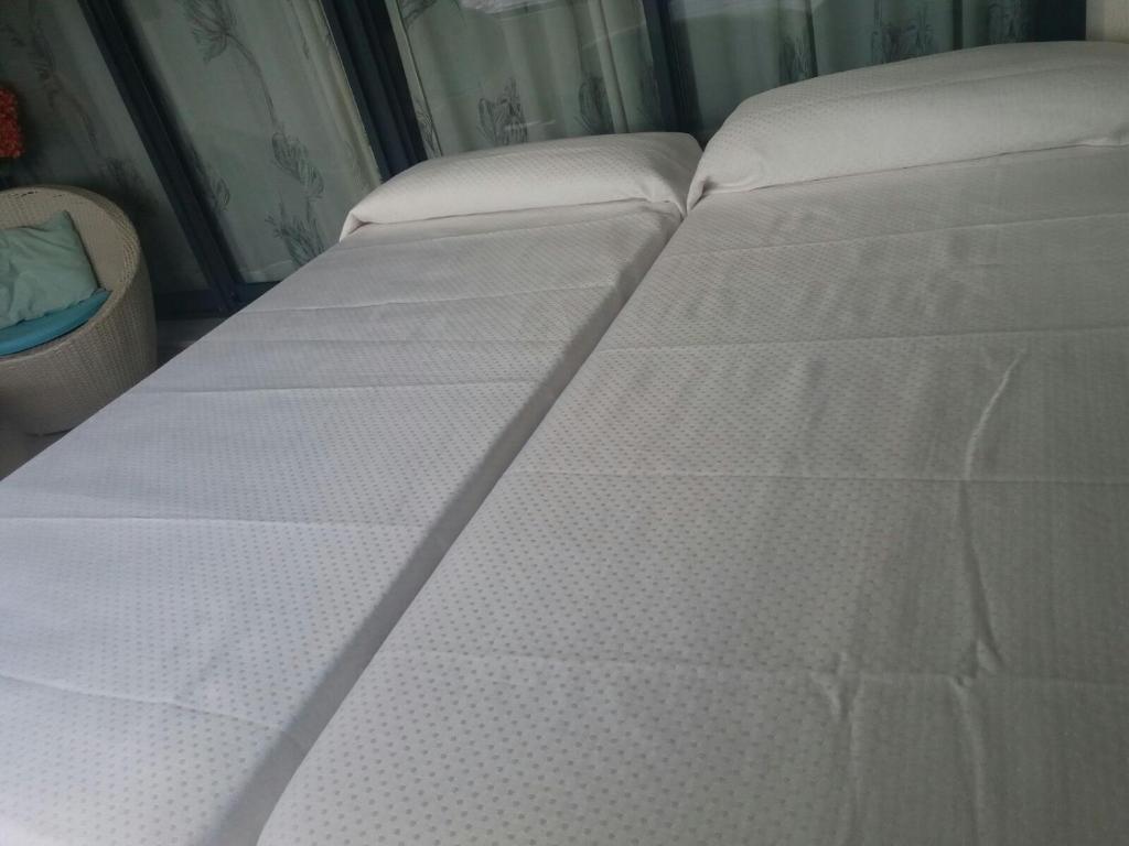 Postel nebo postele na pokoji v ubytování Apartment Carmentxu Gemelos 26