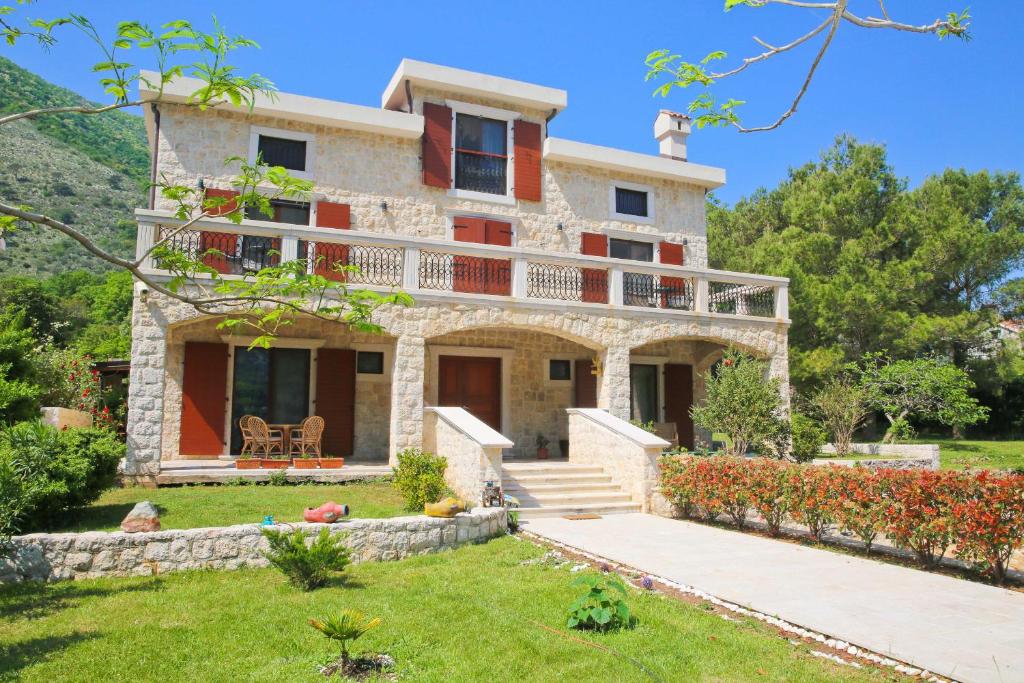 a villa with a view of the house at Palazzo Banicevic Luxury Rooms in Kotor