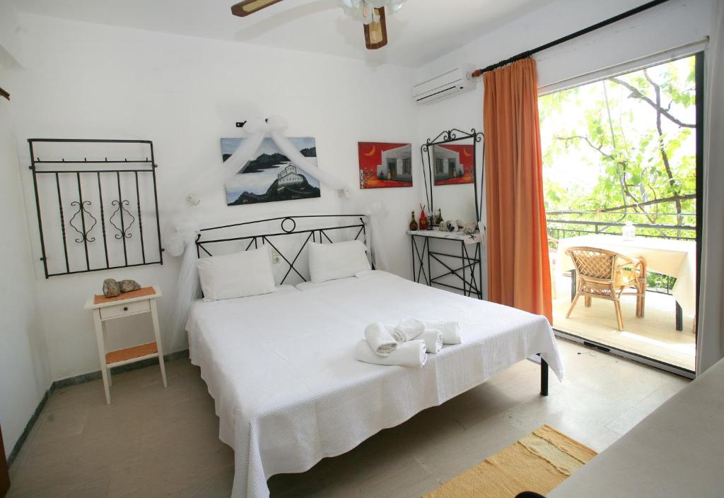 Postel nebo postele na pokoji v ubytování Nakou House