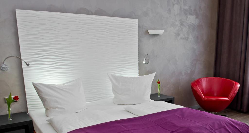 Postel nebo postele na pokoji v ubytování Artim Hotel