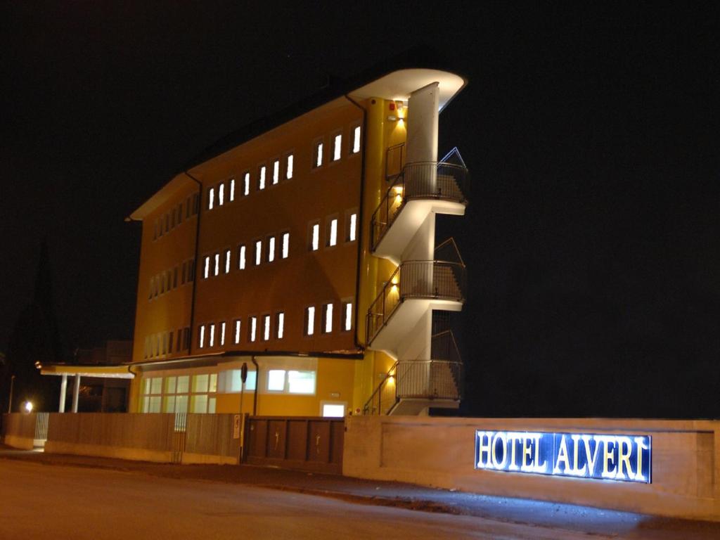 a building with a sign in front of it at night at Hotel Alverì in Mestre