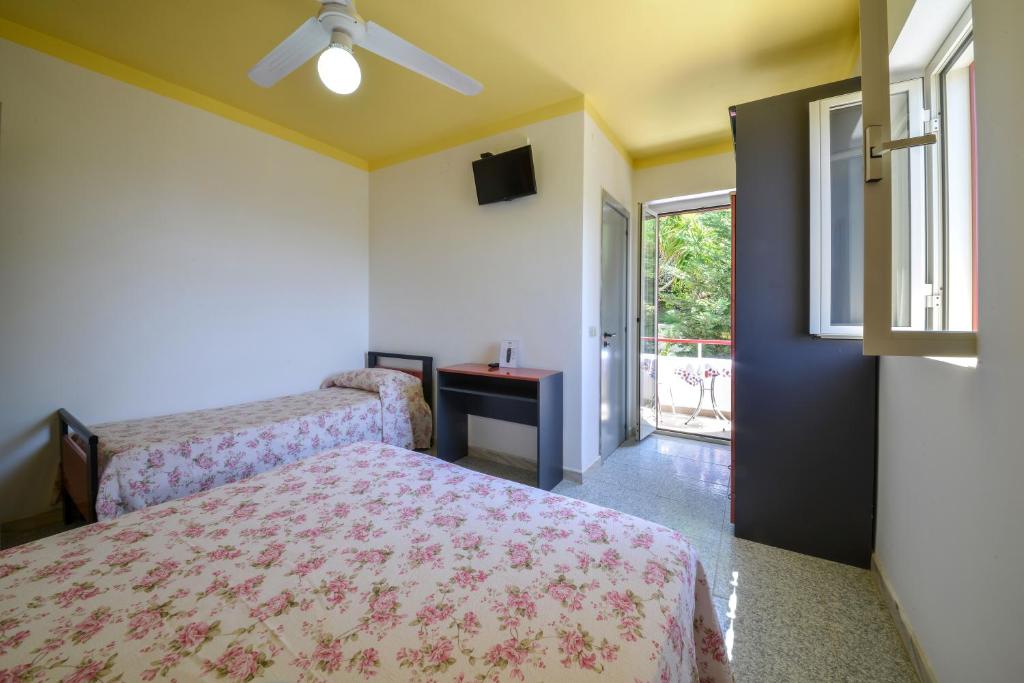 Postel nebo postele na pokoji v ubytování Hotel Piccolo Paradiso
