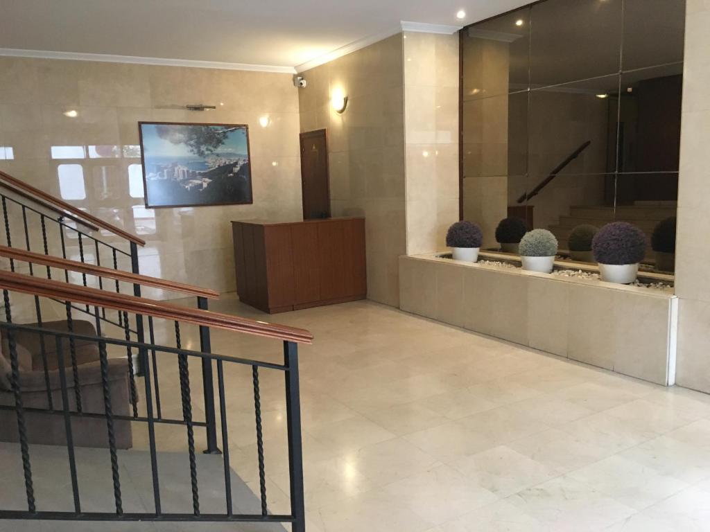 Televízia a/alebo spoločenská miestnosť v ubytovaní Malagueta Beach Premium