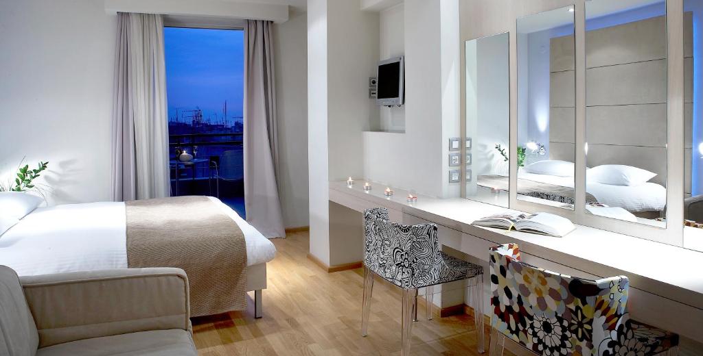 Postel nebo postele na pokoji v ubytování Domotel Olympia