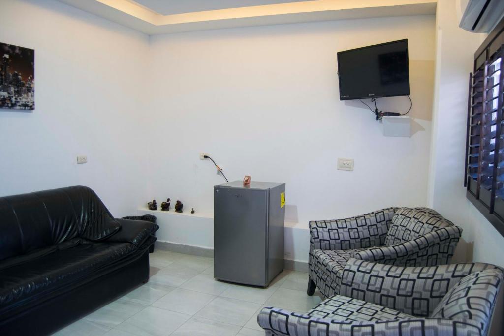 TV i/ili multimedijalni sistem u objektu Hotel Onix Suites