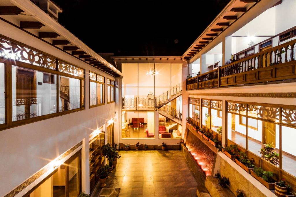 a view of therium of a building at night at Hotel El Giro in Villa de Leyva
