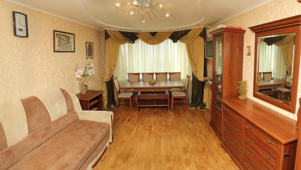 a living room with a couch and a table at Apartment on Shevchenka in Cherkasy