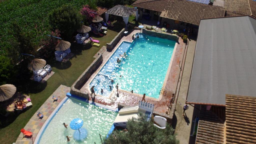 an overhead view of a large swimming pool at Riu Sa Murta in Assemini